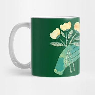 Green hands with yellow flowers on green background Mug